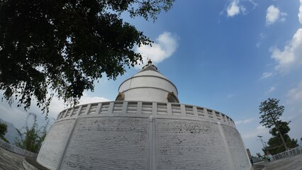Shanti Stupa of Pokhara Framed by Tree Branches
