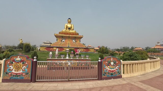 Large Golden Buddha Statue in Garden Area of Lumbini Monastic Complex, Nepal&rsquo;s Sacred Pilgrimage Site