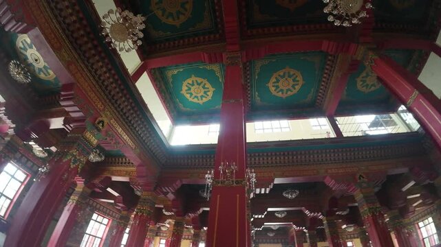 Colorful Painted Ceiling and Ornate Columns at Zhong Hua Chinese Buddhist Monastery Entrance in Lumbini, Nepal