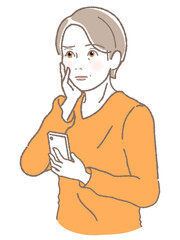 スマホを持って困った顔をする中高年女性