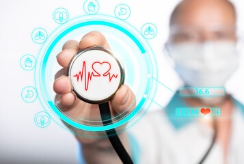 Medical professional displays health metrics with stethoscope and technology in a clinic setting...