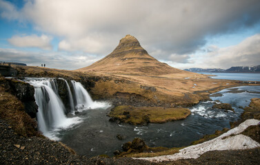 Kirkjufell mountain and the kirkjufellfoss waterfall at grundarfjordur at Snaefellsnes peninsula...