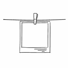 Blank photo frame hanging on a string with a clothespin  