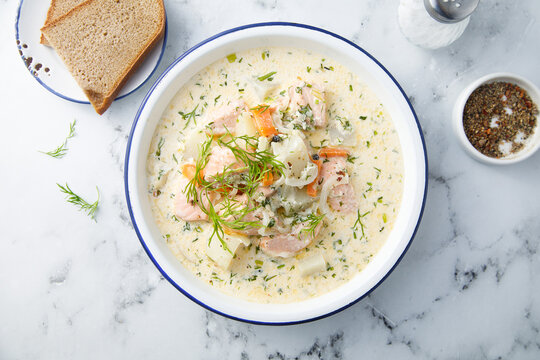 Salmon soup with cream and dill