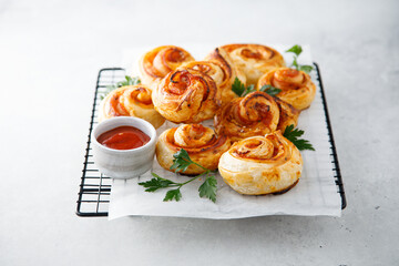 Puff pastry swirls with ham and cheese
