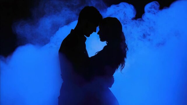 A couple sharing a passionate kiss in the midst of blue smoke. The nightclub atmosphere is highlighted by fog and atmospheric lighting, creating an intimate scene.