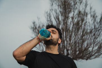 Athlete Refreshes With Water After A Hard Workout