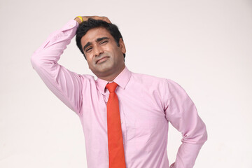 Indian Portraits of young confused sad business man, troubled, deep thought, isolated white background. Negative human emotions, facial expressions, life perception, reaction, attitude on studio.