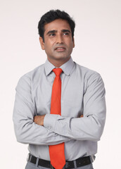 Portrait of a Indian high thinking business man isolated on white studio background making decision or imagining. Business Concept