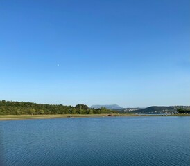 beautiful summer landscape with lake in foreground and mountain in background