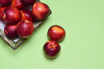 Zenith view, nectarine on green background.