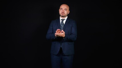 Elegant businessman clapping on black background - Powered by Adobe