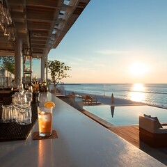 Obraz premium Scenic sunset view of a bar counter with a glass of drink overlooking the ocean under a clear blue sky with empty space for text .