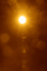 glowing light on blue background, shining effect element. Shining sun at clear blue sky with empty copy space. Sunny summer days with blue heaven. Sunrays, sunbeams, sunburst, sunlight.