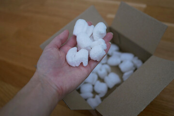 Ecological packaging of parcel box filled with biodegradable filler. The concept of delivery...