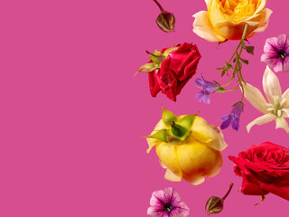 Creative arrangement with various summer flowers against pink background. Minimal nature concept.