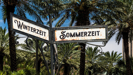 Signposts the direct way to Daylight Saving Time versus Winter Time