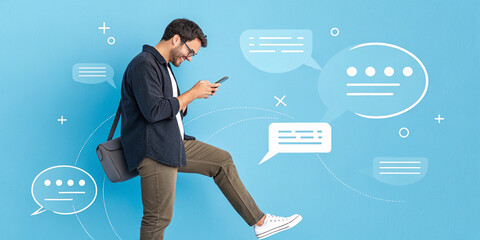 A Man Using a Smartphone Surrounded by Chat Bubbles on a Blue Background Representing Communication