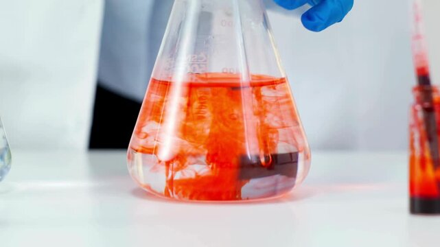Close-Up of Red Food Dye Mixing with Water &ndash; Vivid Color Diffusion and Swirling Liquid in 4K Ultra HD