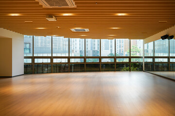 Interior of a university lecture room with neatly arranged desks and chairs for learning.
