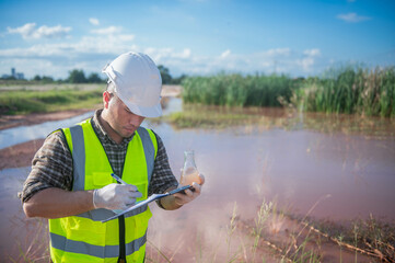 An environmental expert investigates the life in a natural body of water to study its ecosystem.