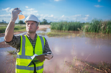 An environmental expert investigates the life in a natural body of water to study its ecosystem.