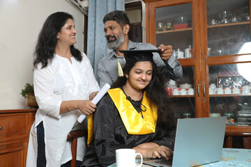 Indian Happy graduate student and proud parents celebrating graduation degree convocation ceremony...