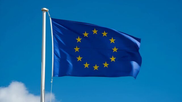 European Union flag waving against clear blue sky background  