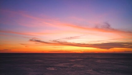 Obraz premium Bold-toned dusk sky casting radiant purple-orange hues on a minimal textured surface with crisp shadow geometry.