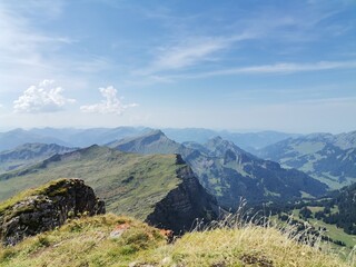 A collection of atmospheric mountain landscapes featuring dramatic cloud formations, drifting fog,...