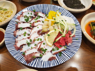 Sliced Boiled Octopus with Assorted Garnishes on a Korean Plate