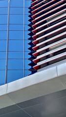Modern building exterior architectural details geometric patterns blue glass facade