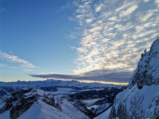 A collection of breathtaking mountain landscapes covered in snow, showcasing the quiet majesty of...