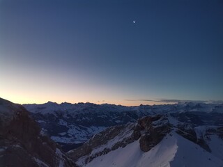 A collection of breathtaking mountain landscapes covered in snow, showcasing the quiet majesty of...