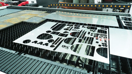 a laser cutting machine processing metal sheets and precisely cutting various shapes