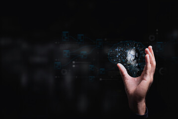 Artificial intelligence and machine learning represented by a human hand holding a digital brain...