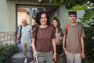 caucasian family with backpacks prepare to go, concept of family trip