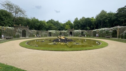 Circular Pond with Statue and Trellis Arches