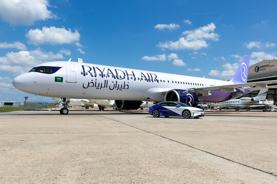 Airbus A321 NEO (XLR) airliner and Lucis Air EV car from Riyadh Air on the tarmac of the airport during the the Paris Air Show. Le Bourget, France - June 16, 2025