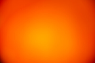 A warm orange gradient for a modern design. Pumpkin color. Summer or autumn background. An orange template with space to copy.