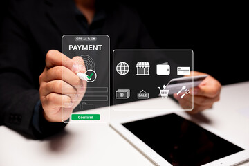 A person uses a credit card and tablet to make a secure online payment via a digital interface with icons and a confirmation button.