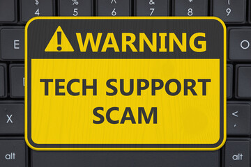 Tech Support Scam yellow warning sign on a computer keyboard