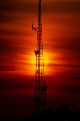 Fototapeta premium Sun Behind a Tower at Sunset 