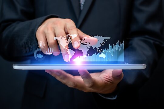 A businessman uses a tablet to analyze global market trends and data visualization showing worldwide economic growth and financial technology - Powered by Adobe