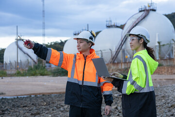 Engineers Discussing Operations at Gas Facility