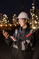 Engineers Conducting Night Inspection at Refinery