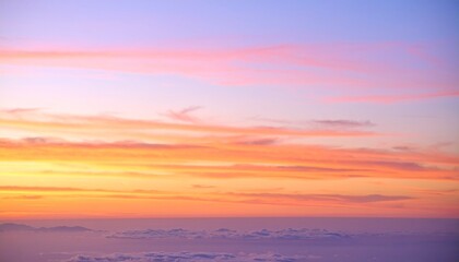 Fototapeta premium Evening sky with delicate pastel clouds, layers of tangerine and lilac flowing across an expansive quiet horizon.