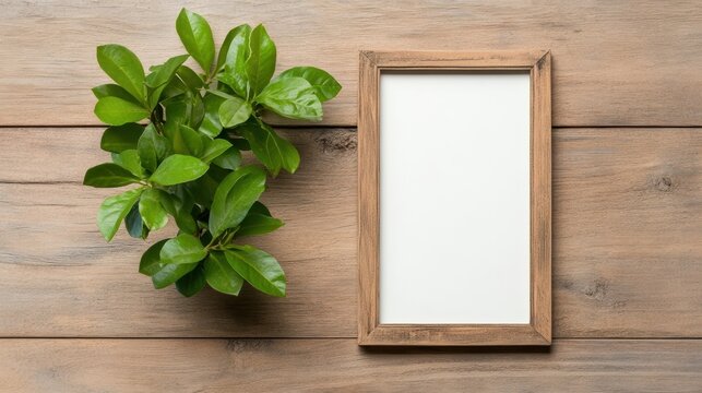 A blank wooden frame next to a vibrant green plant, showcasing a cozy and natural home decor aesthetic perfect for personalized spaces.