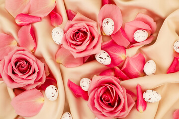 Colorful roses and decorative eggs create a festive spring celebration setting for a joyful occasion