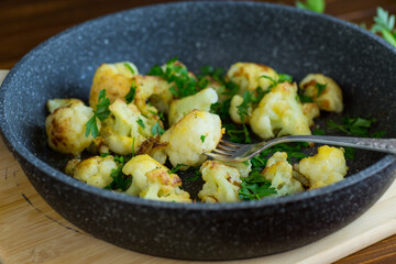 Top view of crispy cauliflower with parsley